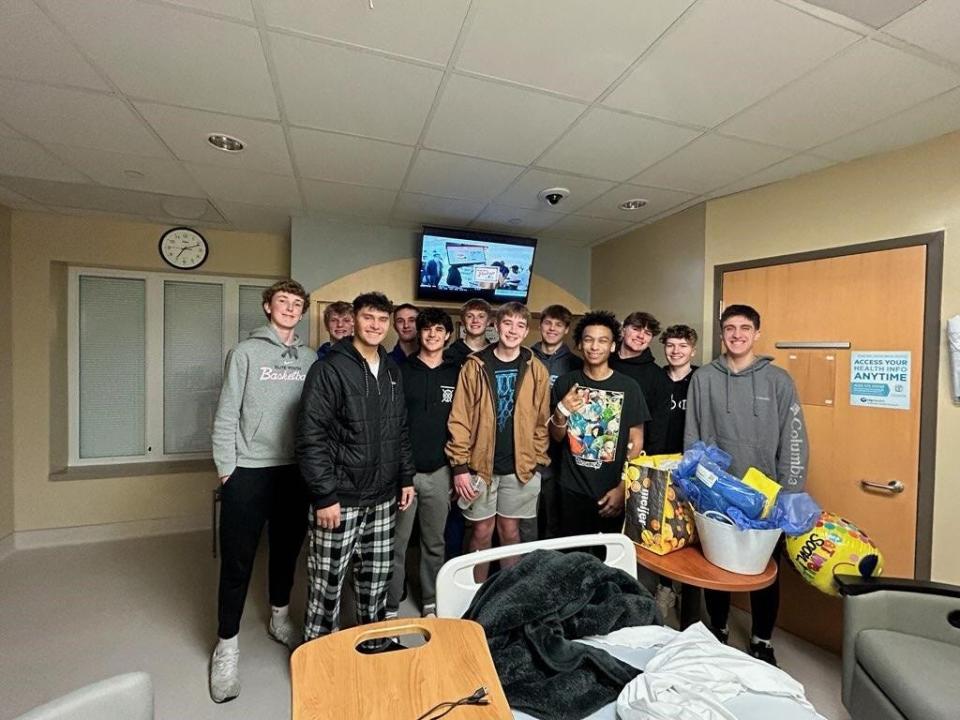 Homestead basketball team visiting Will Jamison (middle) in the hospital after his car accident on Nov. 18, 2023.