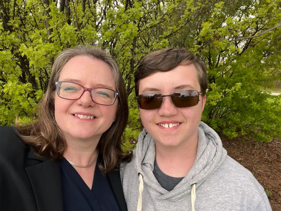 Barbara Gutziet (left) says she wants schools to restrict cell phone access to students like her 14-year-old son Jason.  Gutziet, who lives in Edmonton, says students have other opportunities to conduct research at school and can contact parents through the office.