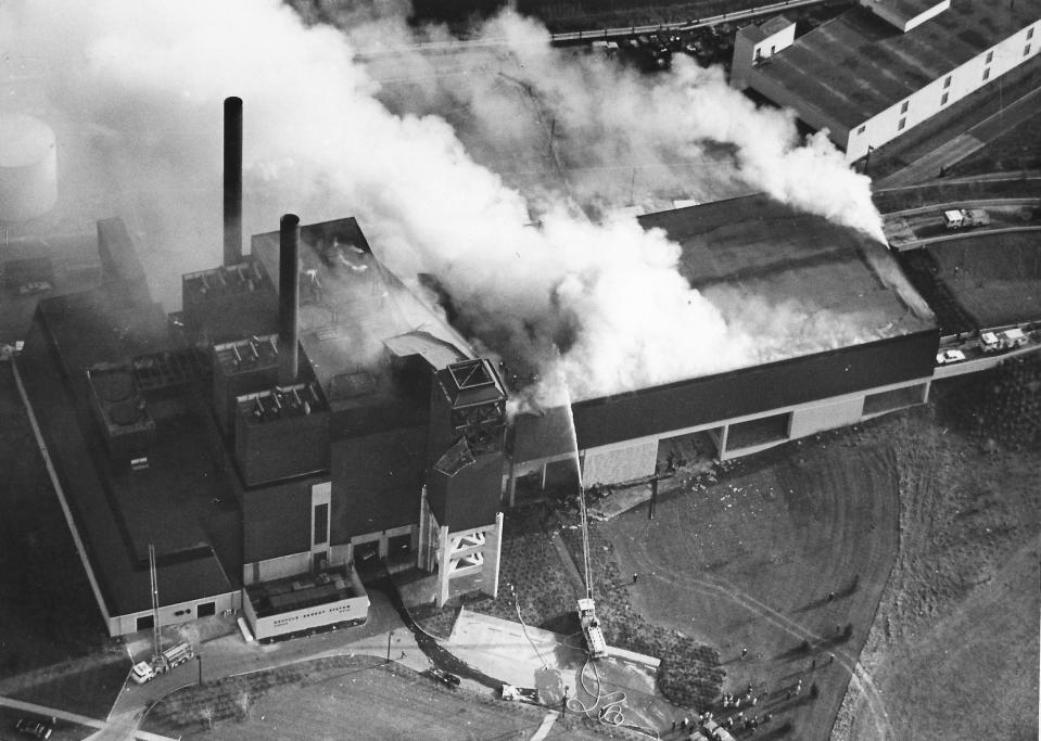 Smoke rises over the Recycle Energy System plant Dec. 20, 1984, on Opportunity Parkway following a series of explosions that killed three workers and injured seven in Akron.