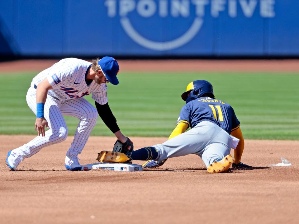 Jackson Chourio steals second base under the tag attempt of Jeff McNeil of the New York Mets on March 29 at Citi Field.