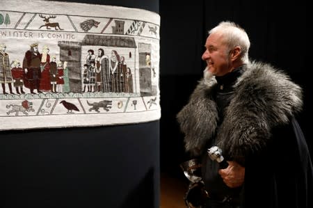 Guide William Van Der Kells of Winterfell Tours looks at the Game of Thrones Tapestry in Bayeux