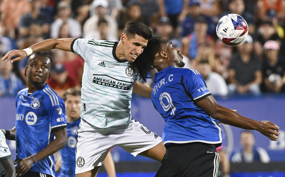 Atlanta United's Luis Abram, left, clears the box as CF Montreal's Chinonso Offor moves in during the second half of an MLS soccer match Saturday, July 8, 2023, in Montreal. (Graham Hughes/The Canadian Press via AP)