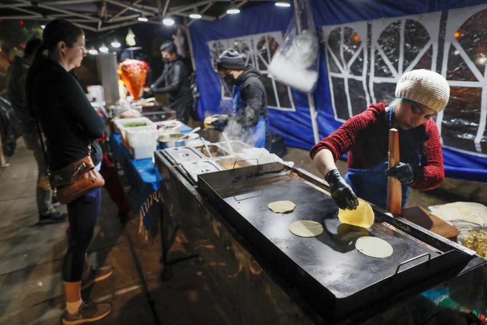 Customers line up at Tacos El Chivo on N. Lakeview Ave. in Anaheim.