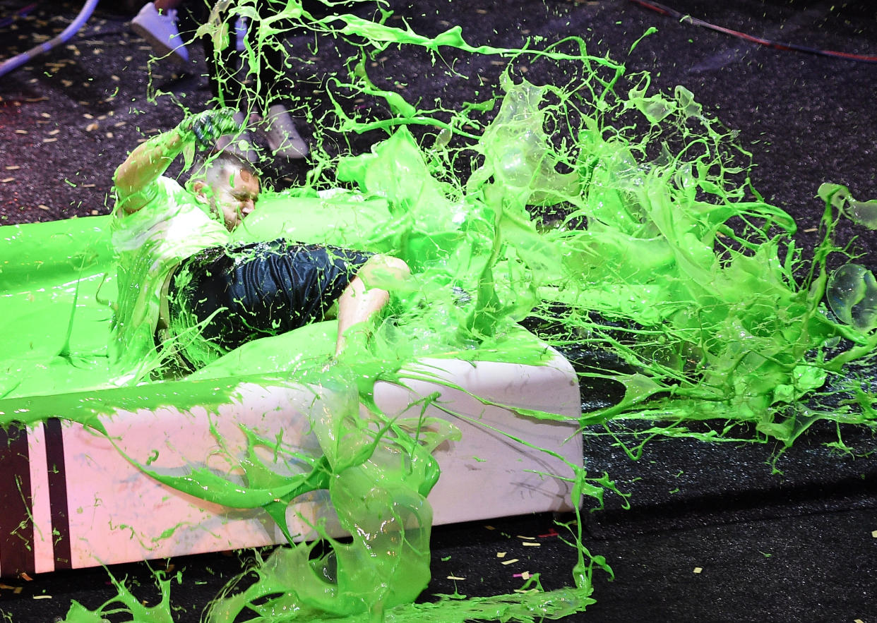 Travis Kelce in green slime. 