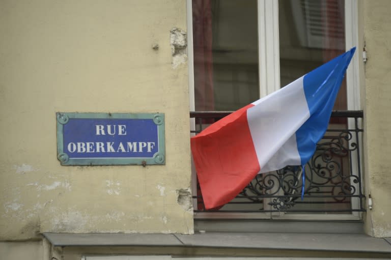 A French flag hangs from a balcony in Paris on November 27, 2015