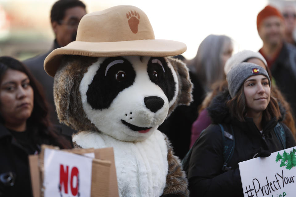 Ranger Rick from the National Wildlife Federation attends a rally of advocates to voice opposition to efforts by the Trump administration to weaken the National Environmental Policy Act, which is the country's basic charter for protection of the outdoors, on Tuesday, Feb. 11, 2020, in Denver. (AP Photo/David Zalubowski)