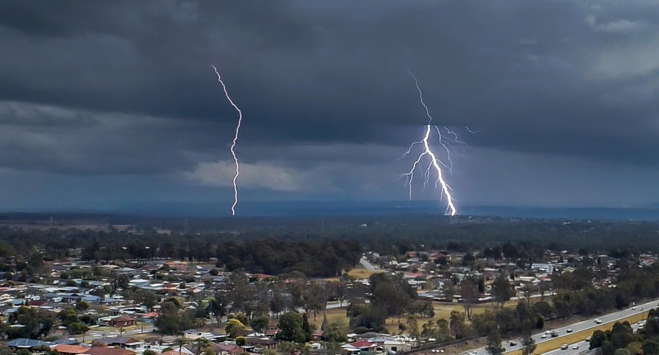 Lightning over houses.