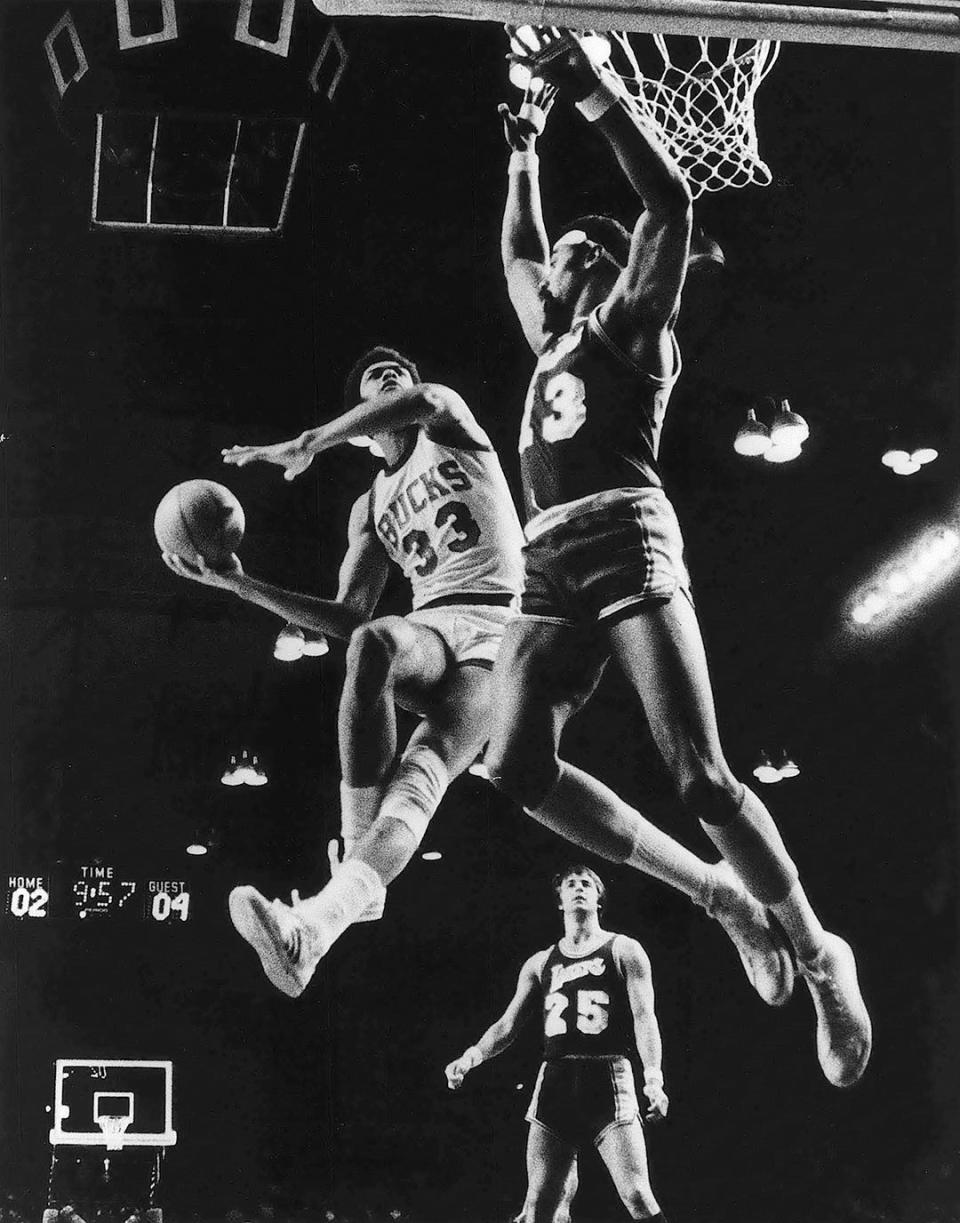 Kareem Abdul-Jabbar of the Bucks gets this shot off against Wilt Chamberlain during the 6th game of the NBA finals won by the Lakers 104-100. The victory eliminated Milwaukee from playoffs.