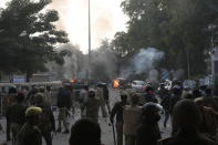 LUCKNOW, INDIA - DECEMBER 19: Demonstrators and police face off during an anti Citizenship Amendment Act (CAA) and National Register of Citizens (NRC) protest at Parivartan Chowk area on December 19, 2019 in Lucknow, India. The act seeks to grant Indian citizenship to refugees from Hindu, Christian, Sikh, Buddhist and Parsi communities fleeing religious persecution from Pakistan, Afghanistan, and Bangladesh, and who entered India on or before December 31, 2014. The Parliament had passed the Citizenship (Amendment) Bill, 2019 last week and it became an act after receiving assent from President Ram Nath Kovind. Since then, protests including some violent ones have erupted in various regions of the country, including the North East over the amended citizenship law. (Photo by Dheeraj Dhawan/Hindustan Times via Getty Images)