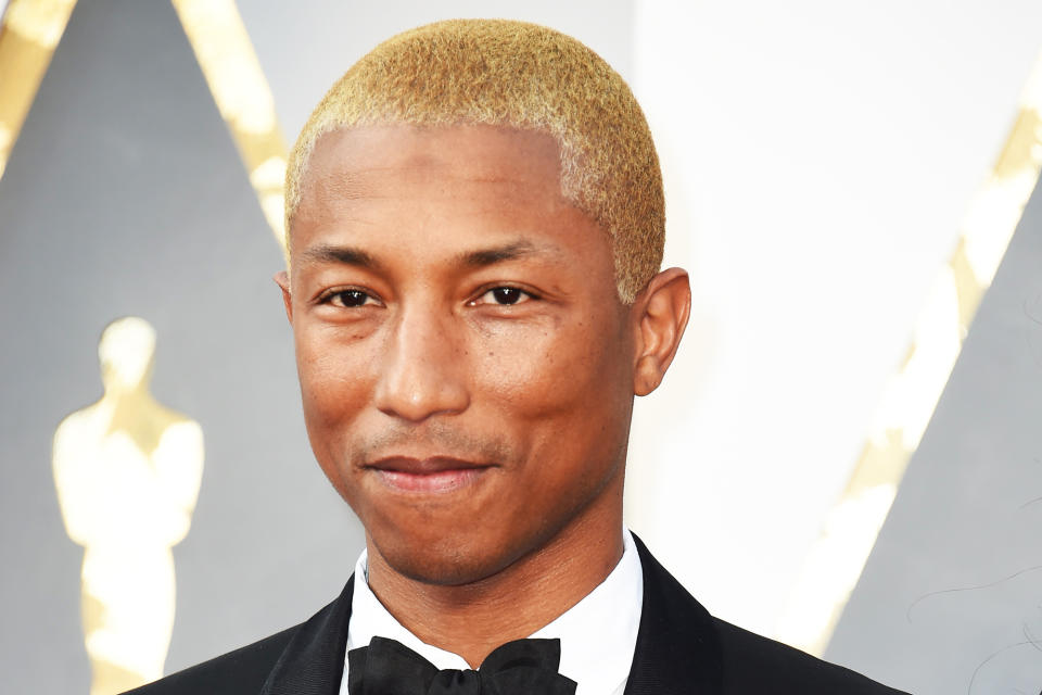 Pharrell Williams at the 2017 Grammy Awards with platinum blond hair. (Photo: Valerie Macon/AFP/Getty Images)