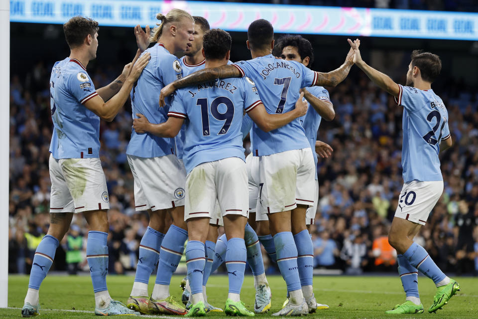 Manchester City players celebrate scoring against Nottingham Forest in their English Premier League clash. 