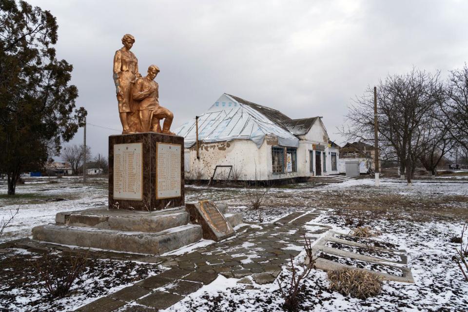 A statue honoring local residents who fought in World War II stands in Myrolyubivka, Ukraine.
