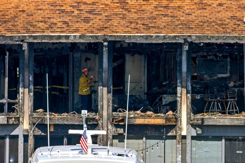 MARINA DEL REY, CA - DECEMBER 12: Two firefighters injured fighting a massive overnight fire that destroyed a decades-old California Yacht Club on Tuesday, Dec. 12, 2023 in Marina Del Rey, CA. (Irfan Khan / Los Angeles Times)