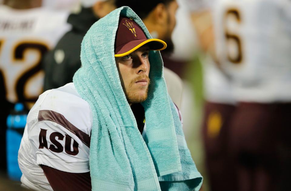 BOULDER, CO - SEPTEMBER 13: Quarterback Taylor Kelly #10 of the Arizona State Sun Devils looks on from the bench against the Colorado Buffaloes in the fourth quarter at Folsom Field on September 13, 2014 in Boulder, Colorado. The Sun Devils defeated the Buffaloes 38-24. (Photo by Doug Pensinger/Getty Images)