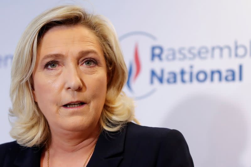 FILE PHOTO: French far right leader Marine Le Pen reacts to the results of regional election, in Nanterre