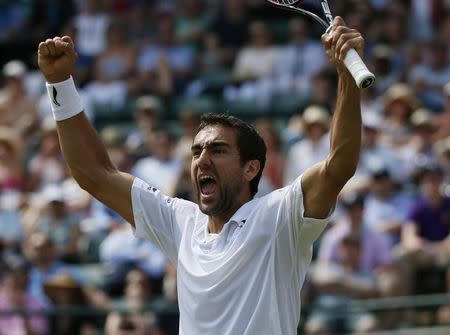 Marin Cilic of Croatia celebrates after winning his match against John Isner of the U.S.A. at the Wimbledon Tennis Championships in London, July 4, 2015. REUTERS/Stefan Wermuth