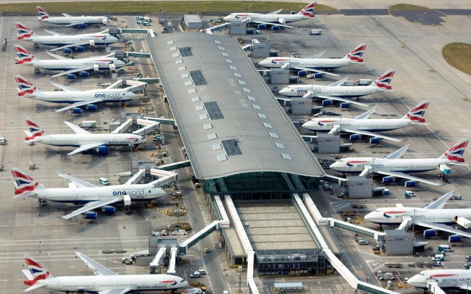 Aerial view of one of Terminal 5 buildings of London Heathrow Airport and Boeing 747 and 777 aircrafts operated by British Airways at the gates - Grzegorz Bajor