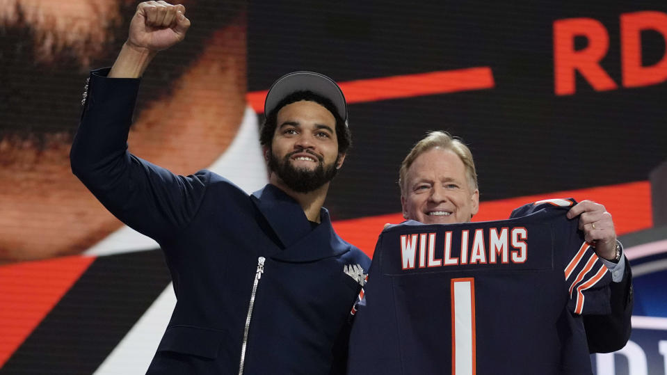 Southern California quarterback Caleb Williams celebrates with NFL commissioner Roger Goodell after being chosen by the Chicago Bears with the first overall pick during the first round of the NFL football draft, Thursday, April 25, 2024, in Detroit. (AP Photo/Jeff Roberson)