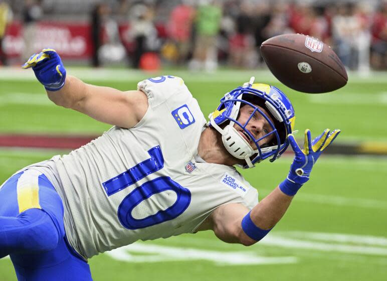 Los Angeles Rams wide receiver Cooper Kupp (10) working out on the field.