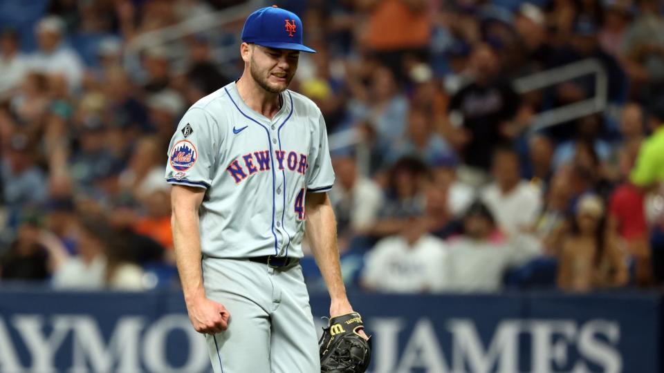 May 4, 2024; St. Petersburg, Florida, USA; New York Mets starting pitcher Christian Scott (45) reacts at the end of the first inning against the Tampa Bay Rays at Tropicana Field.