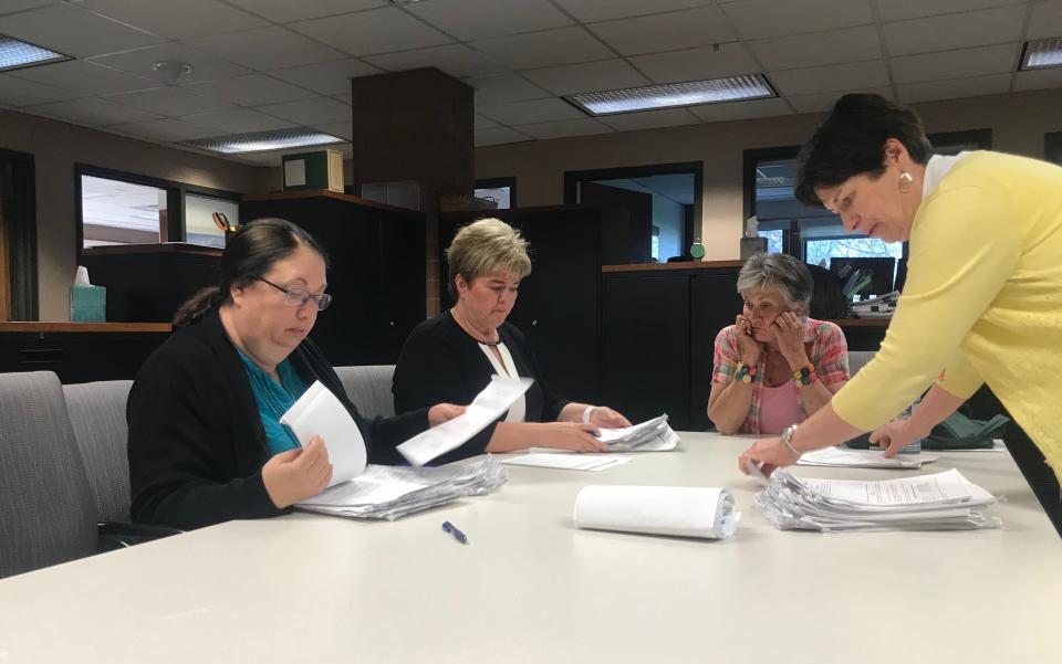 The City Clerk and her staff count petition packets in this file photo.