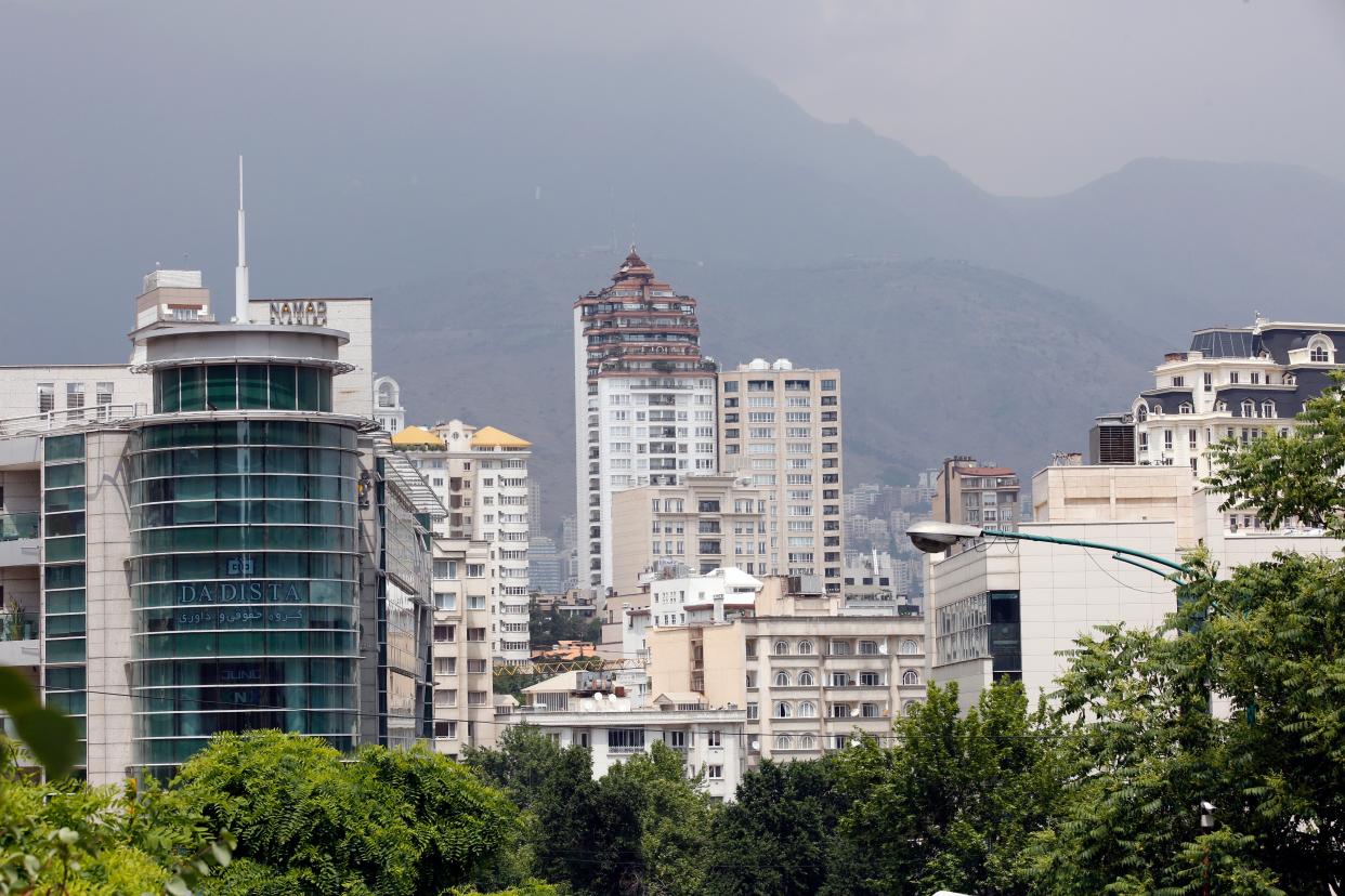 The woman fell to her death in the upmarket Kamranieh neighbourhood in Tehran (EPA)