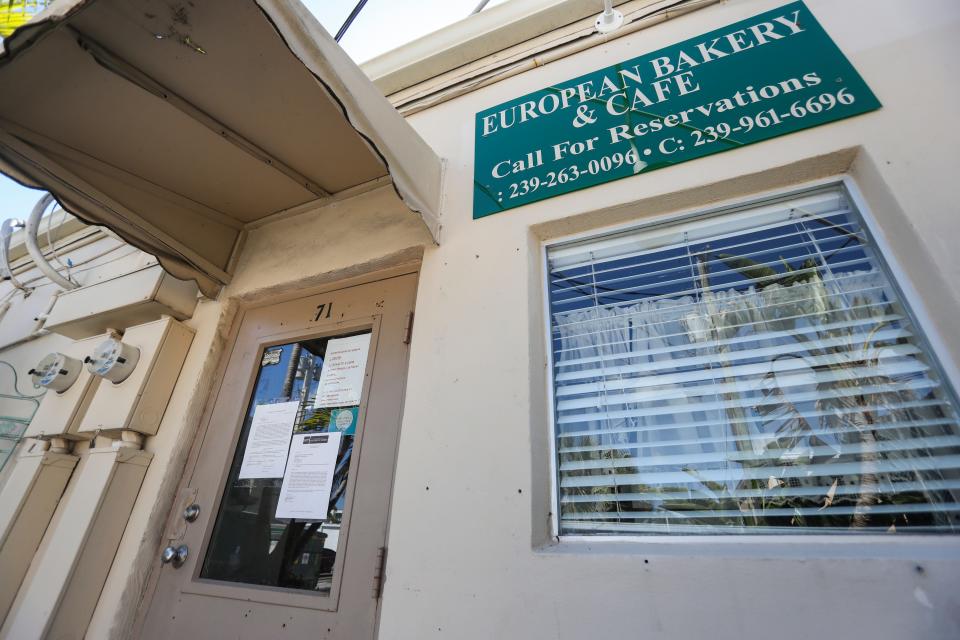 Legal notices are posted on the entrance to the European Bakery and Cafe in Naples on Friday, March 24, 2023.