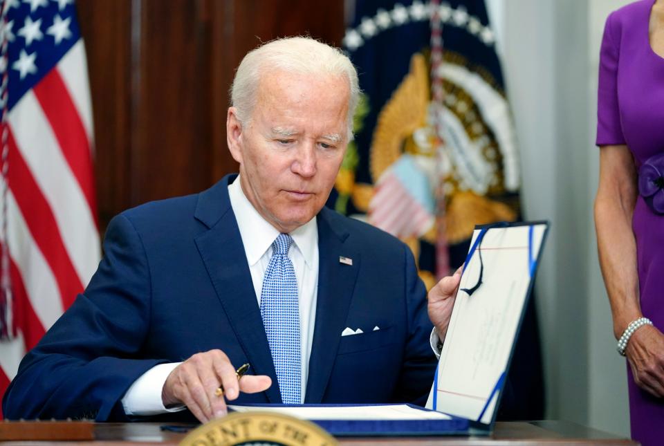 President Joe Biden signs into law S. 2938, the Bipartisan Safer Communities Act gun safety bill, in the Roosevelt Room of the White House in Washington, June 25, 2022. (AP Photo/Pablo Martinez Monsivais, File)