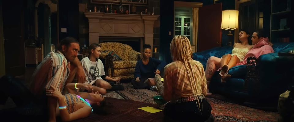 Group of people, including Amandla Stenberg, Maria Bakalova, Rachel Sennott, and Chase Sui Wonders, sitting and reclining in a living room setting