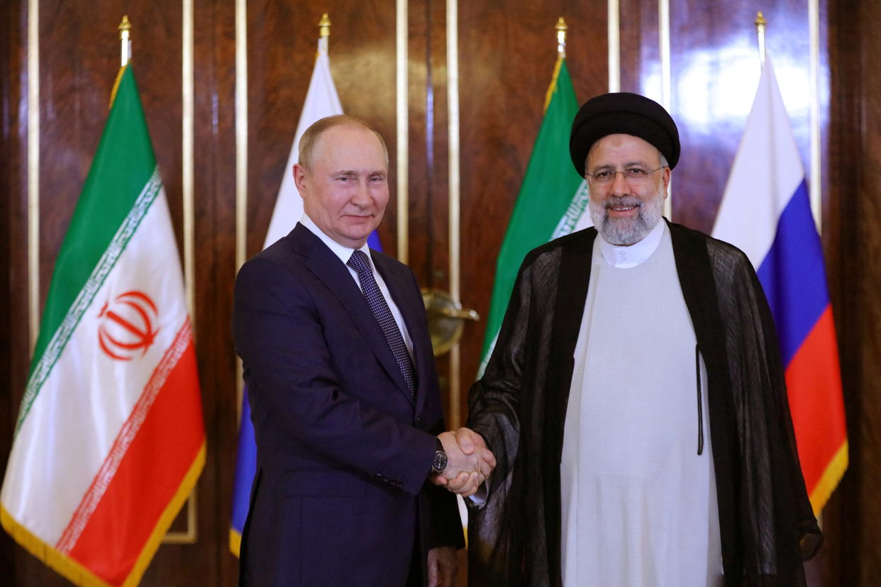 Russian President Vladimir Putin and Iranian President Ebrahim Raisi shake hands in Tehran, Iran.