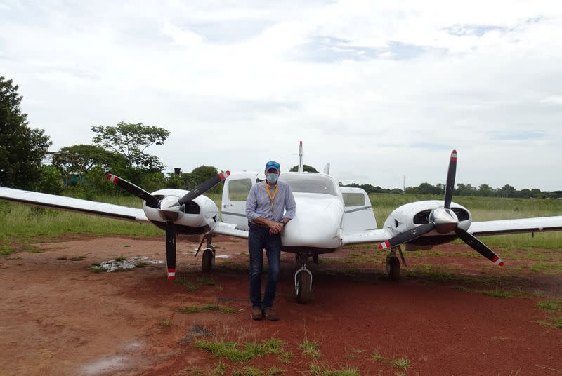Colombian businessman and pilot Ernesto Perez, who donates flights to collect samples of the coronavirus disease (COVID-19) in villages with difficult access, poses for a photo in front of his plane at La Primavera airport, in La Primavera