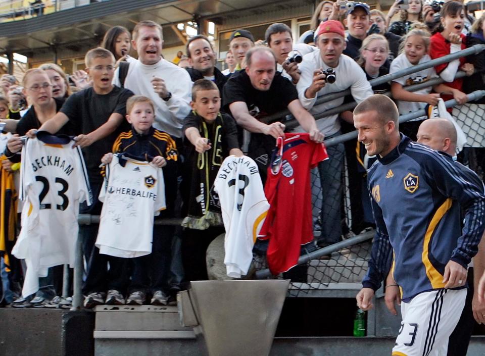 Fans go crazy taking pictures and asking for autographs as the Los Angeles Galaxy's David Beckham takes the field at a sold-out Crew Stadium for the first time since joining the MLS on Oct. 4, 2008. Beckham missed the 2007 game against the Crew because of an injury. The Crew won the game 1-0.