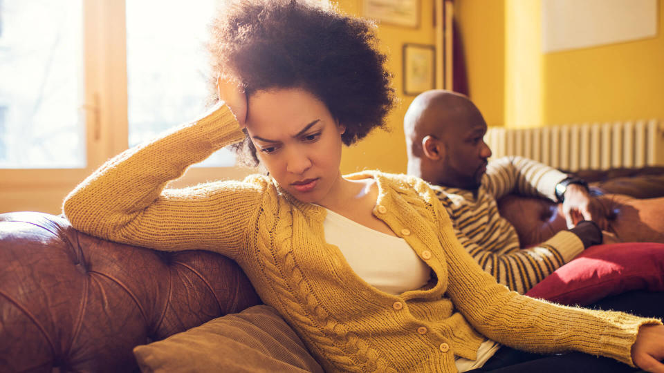 Angry African American woman had a fight with her boyfriend at home.