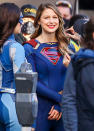 <p>Melissa Benoist smiles in full costume while prepping to film <em>Supergirl</em> in Vancouver on Monday.</p>