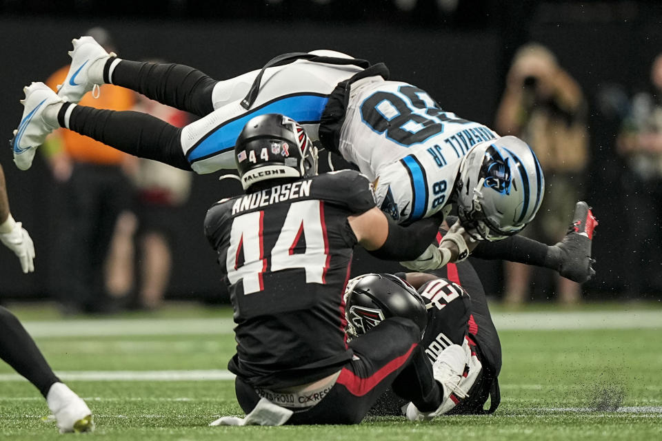 Atlanta Falcons linebacker Troy Andersen (44) hits Carolina Panthers wide receiver Terrace Marshall Jr. (88) during the first half of an NFL football game, Sunday, Sept. 10, 2023, in Atlanta. (AP Photo/Brynn Anderson)