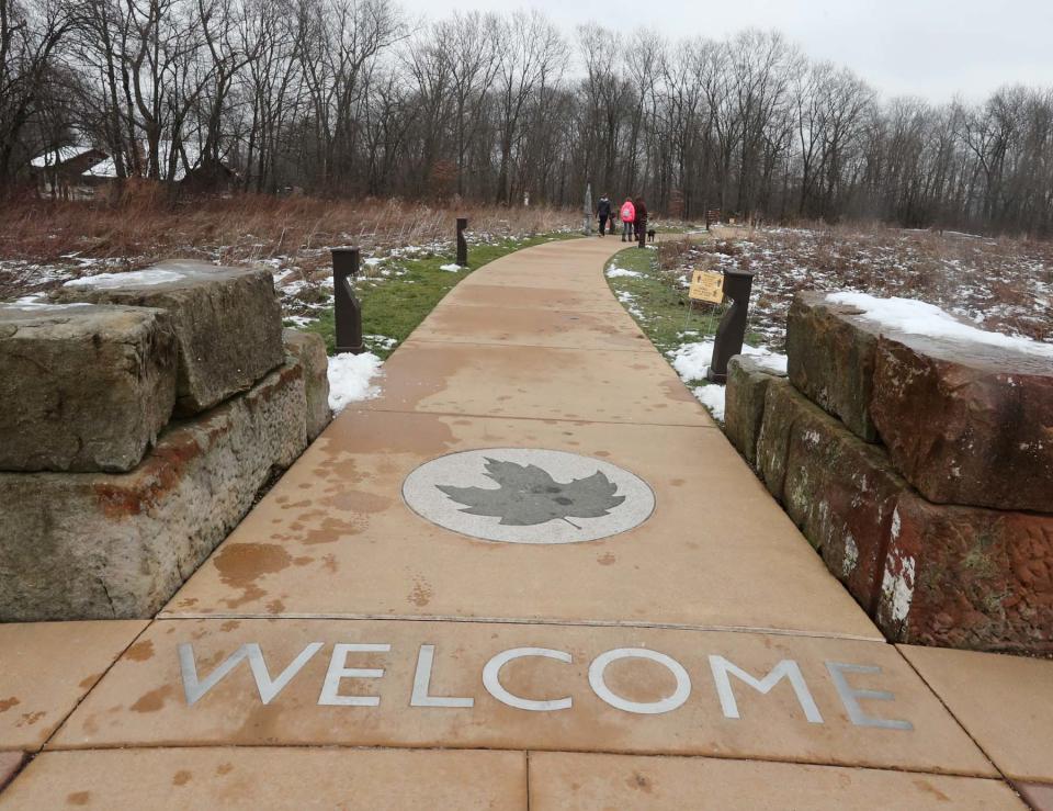 A walkway leads to trails and the nature center at Liberty Park in Twinsburg.