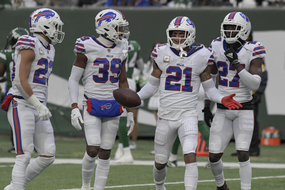 Buffalo Bills' Jordan Poyer (21), second from right, reacts after his interception during the second half of an NFL football game against the New York Jets, Sunday, Nov. 14, 2021, in East Rutherford, N.J. (AP Photo/Bill Kostroun)