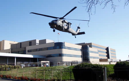 An Oregon Army National Guard Black Hawk helicopter lifts off after a rescue from Mount Hood, at Legacy Emanuel Medical Center in Portland, Oregon, U.S., February 13, 2018. REUTERS/Steve Dipaola
