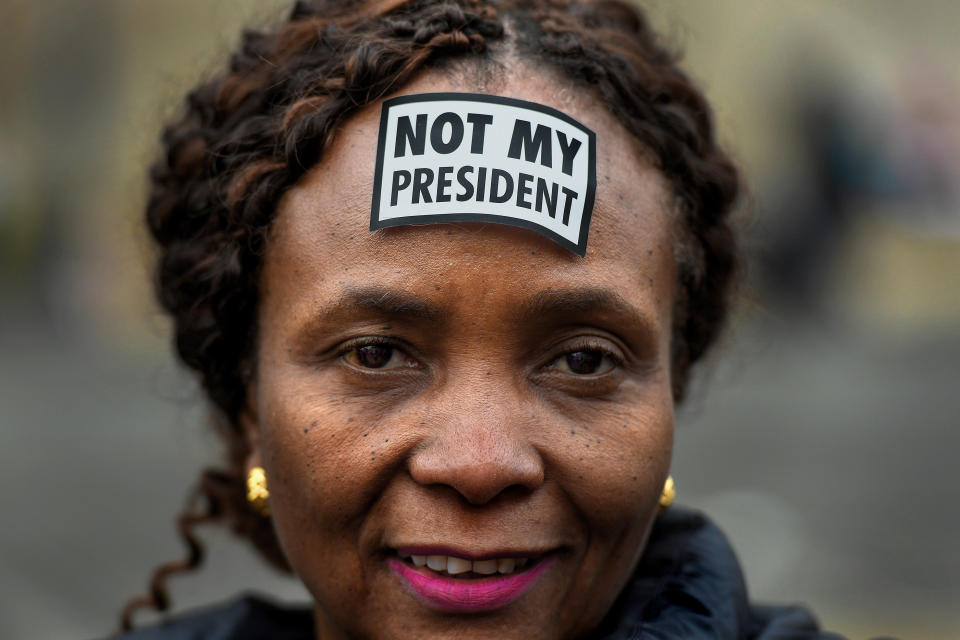 Women's March participant Suzanne Damas of Brooklyn, New York, wears a simple sticker on her forehead to let people know what she thinks of Trump.