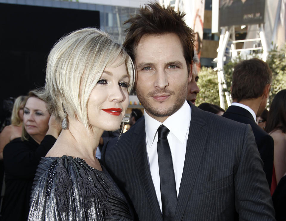 FILE - In this June 24, 2010 file photo, actress Jennie Garth, left, and her husband actor Peter Facinelli arrive at the premiere of "The Twilight Saga: Eclipse" in Los Angeles. The couple filed for divorce in Los Angeles on Wednesday, March 28, 2012, citing irreconcilable differences for their breakup after nearly 11 years of marriage. They have three children together. (AP Photo/Matt Sayles, file)