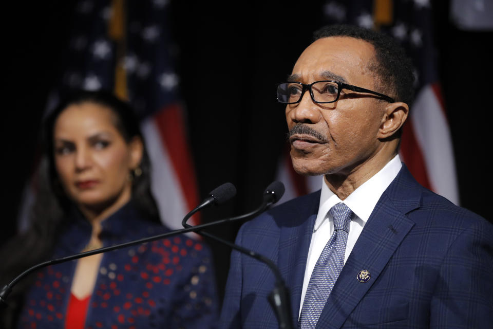 Democrat Kweisi Mfume, right, speaks as his wife, Tiffany Mfume, looks on during an election night news conference at his campaign headquarters after he won the 7th Congressional District special election, Tuesday, April 28, 2020, in Baltimore. Mfume defeated Republican Kimberly Klacik to finish the term of the late Rep. Elijah Cummings, retaking a Maryland congressional seat Mfume held for five terms before leaving to lead the NAACP. All voters in the 7th Congressional District were strongly urged to vote by mail in an unprecedented election dramatically reshaped by the coronavirus pandemic. (AP Photo/Julio Cortez)