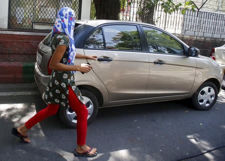 A veiled Nepali woman, who told police she was raped by a Saudi official, walks outside Nepal's embassy in New Delhi, September 9, 2015. REUTERS/Anindito Mukherjee