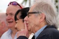Director Ken Loach jokes with photographers during a photocall for the film "I, Daniel Blake" in competition at the 69th Cannes Film Festival in Cannes, France, May 13, 2016. REUTERS/Jean-Paul Pelissier