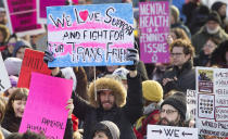 <p>People hold up signs during a women’s march in Montreal, Saturday, Jan. 20, 2018. At least 38 municipalities across Canada, including Halifax, Montreal, Toronto and Vancouver, will host marches, rallies or other events throughout the day. (Photo: Graham Hughes/The Canadian Press via AP) </p>