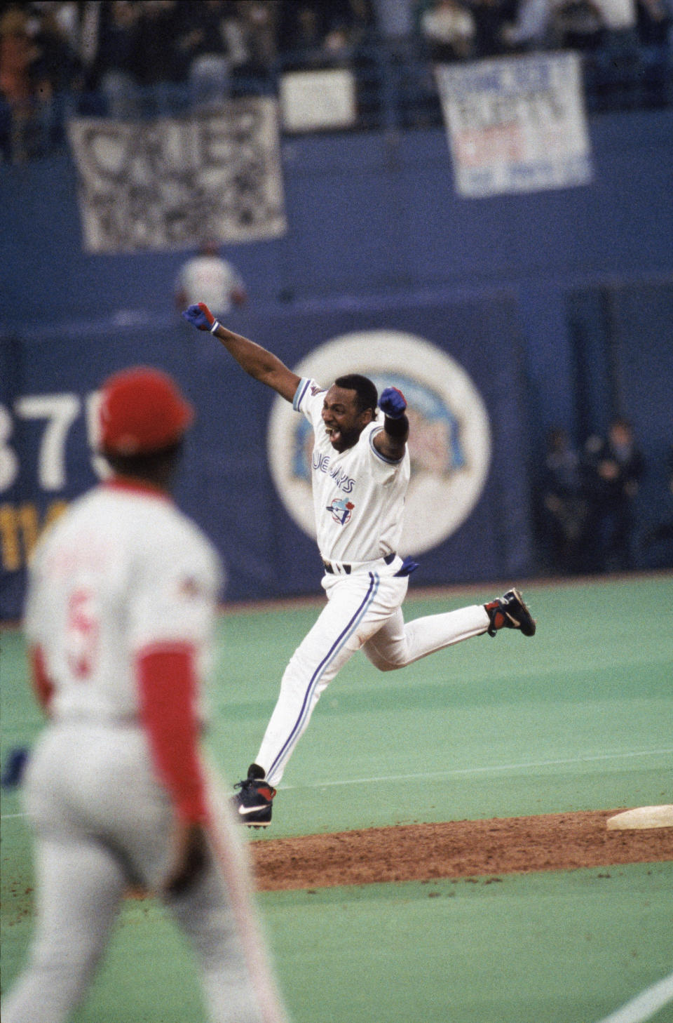 TORONTO,CANADA - OCTOBER 23: Joe Carter #29 of the Toronto Blue Jays celebrates his home run during game six of the 1993 World Series against the Philadelphia Phillies at the Skydome on October 23,1993 in Toronto, Canada. The Blue Jays won 8-6. (Photo by MLB Photos via Getty Images)