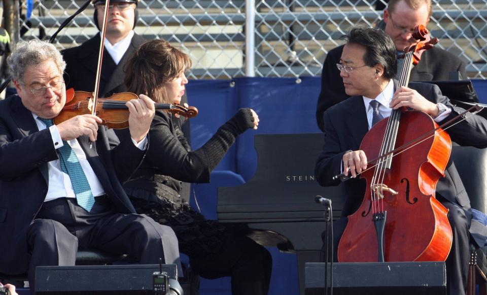 Pianist Gabriella Montero, center, is pictured with violinist Itzhak Perlman (left) and cellist Yo-Yo Ma at the 2009 inauguration of President Obama in Washington, D.C. Montero will be featured in a performance of "Latin Concerto" as part of the season opening concert of the Daytona Beach Symphony Society on Sunday at Peabody Auditorium.