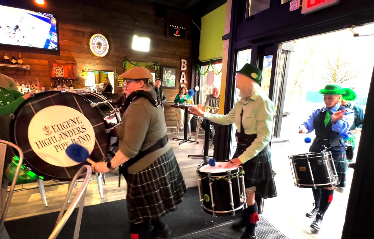The Eugene Highlanders Pipe Band perform at the 6th Street Restaurant & Sports Bar during St. Patrick's Day 2023.
