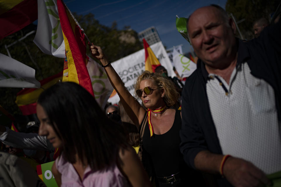 Demonstrators march during a celebration for Spain's National Day in Barcelona, Spain, Tuesday, Oct. 12, 2021. Spain commemorates Christopher Columbus' arrival in the New World and also Spain's armed forces day. (AP Photo/Joan Mateu Parra)