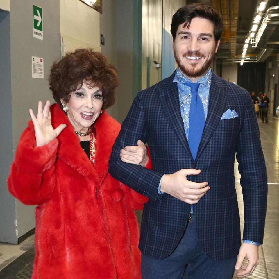 Gina Lollobrigida walks arm in arm with Mr Piazzolla - Ferrajuolo/SGP/Shutterstock