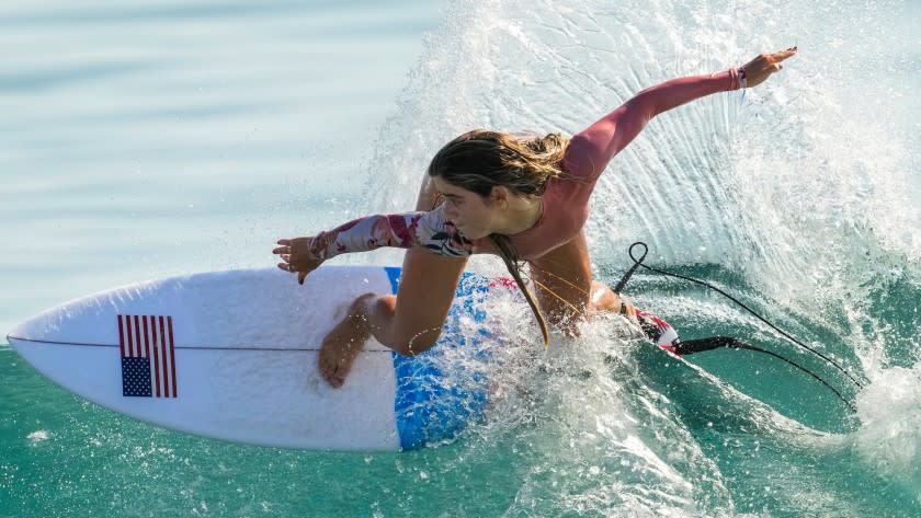 Caroline Marks, of the United States, rides a wave during a training session.